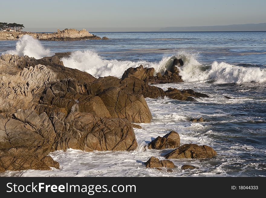 Central California shoreline with waves crashing against rocks - Pacific Grove. Central California shoreline with waves crashing against rocks - Pacific Grove