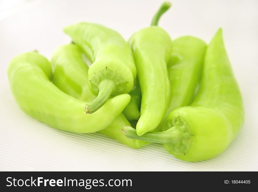 Fresh green paprika on white background
