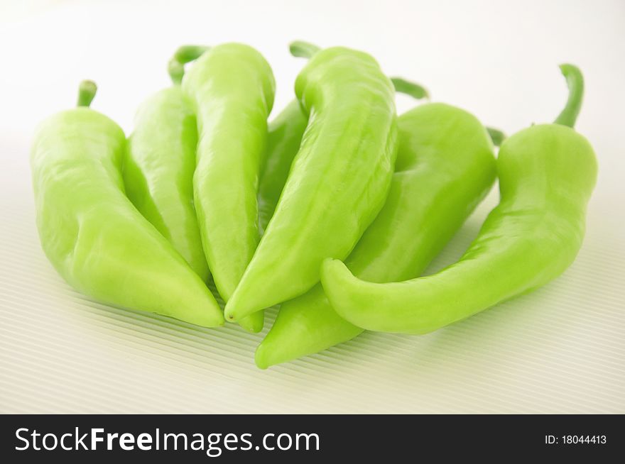 A green paprika on white background. A green paprika on white background