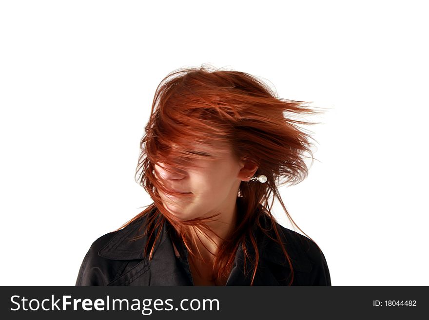 An red haired girl having fun by waving her hair. An red haired girl having fun by waving her hair