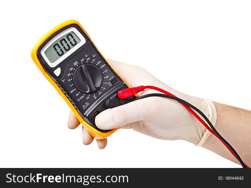 Hand in rubber glove holding an electronic tester. Hand in rubber glove holding an electronic tester