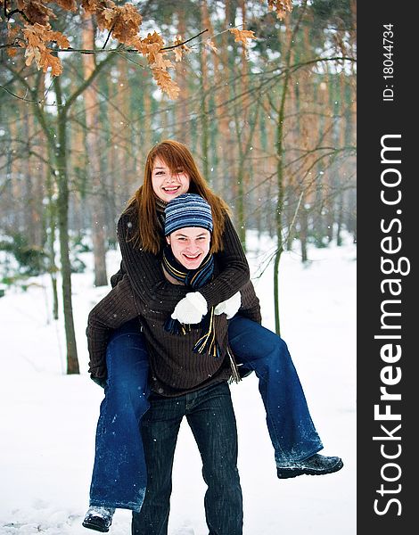 Young couple in love smiling in winter. Young couple in love smiling in winter