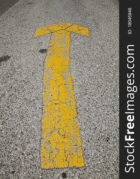 Yellow arrow on road texture