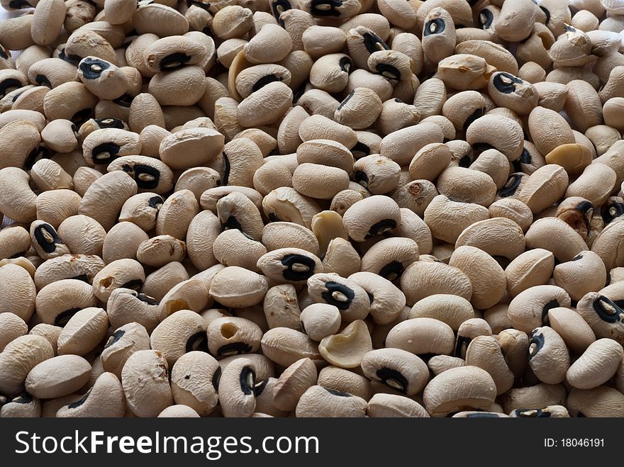 A collection of black-eyed peas filling the horizontal frame