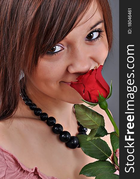 Beautiful woman with red rose