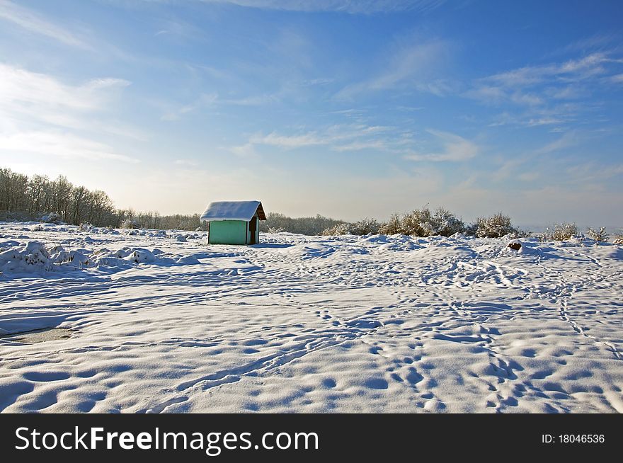 Walking traces to alpine shelter in winter time