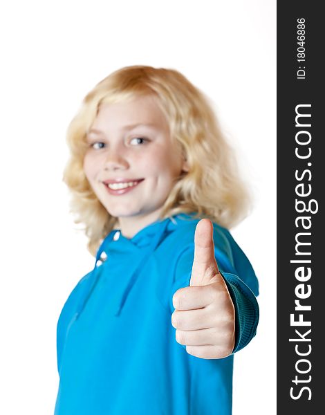 Young beautiful girl / child shows thumb up. Isolated on white background.