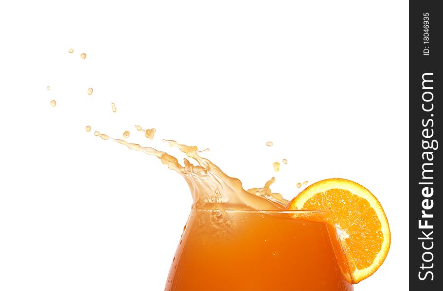Glass of splashing orange juice isolated on white background with clipping path. Glass of splashing orange juice isolated on white background with clipping path