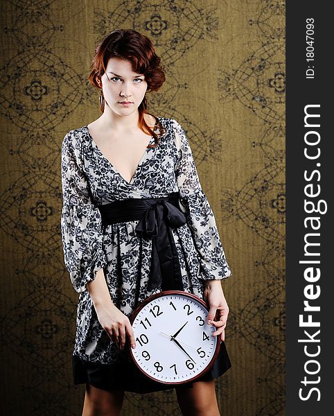 An image of a woman with a clock