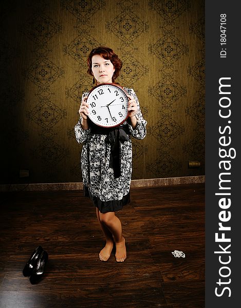 An image of a woman with a clock