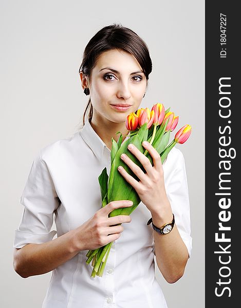 An image of young businesswoman with tulip. An image of young businesswoman with tulip