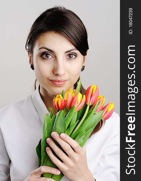 An image of young girl with tulip. An image of young girl with tulip