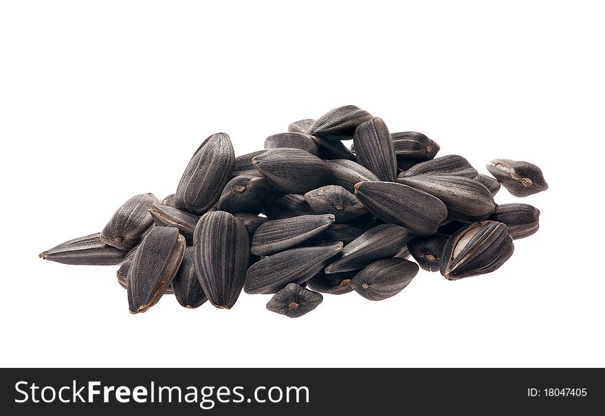 Heap of sunflower seeds isolated on white background