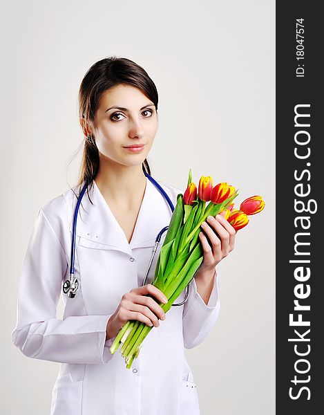 An image of doctor with tulips