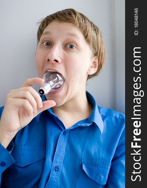 Adorable boy holding a light bulb. Adorable boy holding a light bulb