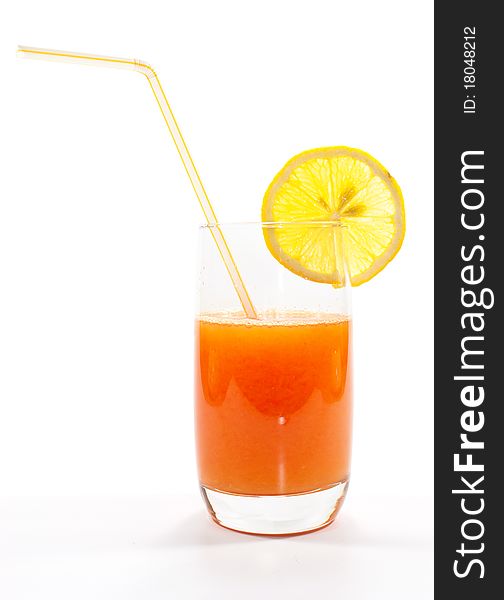 Fresh juice isolated on white background with a lemon on it.