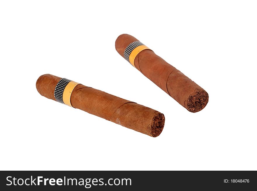 Large, fragrant cigar lying on a white background. Large, fragrant cigar lying on a white background