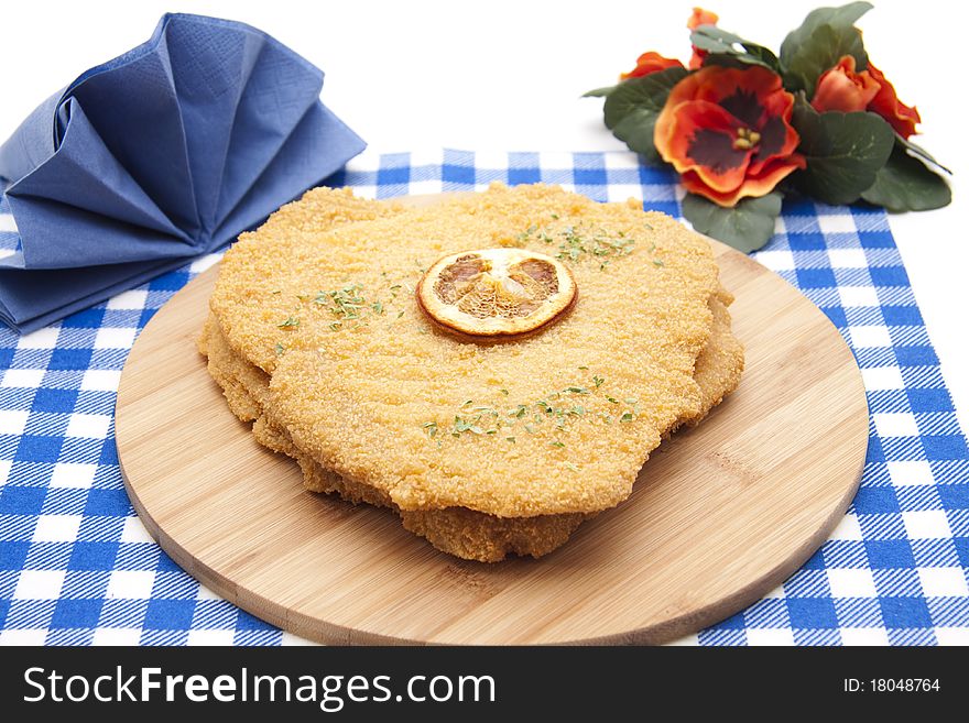 Escalope raw with lemon and napkin