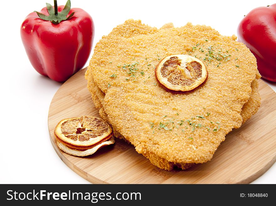 Escalope raw with lemon and red paprikas. Escalope raw with lemon and red paprikas