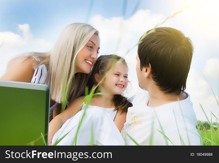 Happy family enjoy on the meadow. Happy family enjoy on the meadow