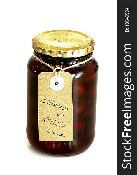 Jar of cherries preserved in alcoholic beverage. Jar of cherries preserved in alcoholic beverage