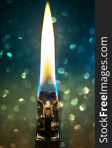 Zippo Lighter Closeup With Flame Bokeh Background