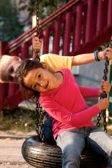 Boy And Girl On Swing Stock Image Boy And Girl On Swing Stock Image