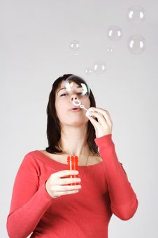 Woman In Red Shirt Blowing Out Soap Bubbles Royalty Free Stock Images Woman In Red Shirt Blowing Out Soap Bubbles Royalty Free Stock Images