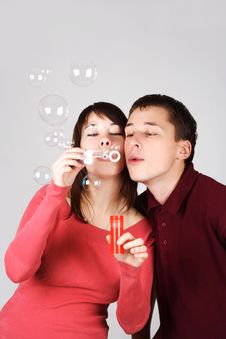 Man And Woman Blowing Out Soap Bubbles Stock Photos Man And Woman Blowing Out Soap Bubbles Stock Photos