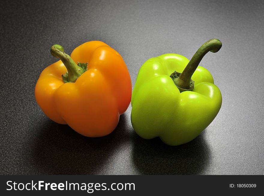 Two Peppers On A Kitchen Table