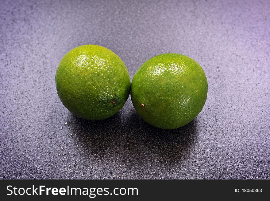 Two Limes On A Table