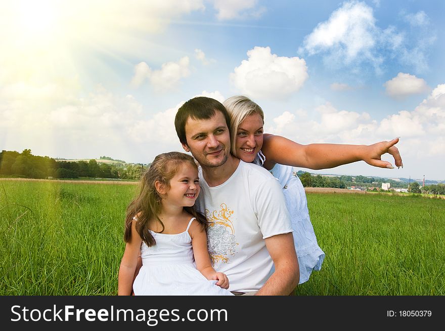 Playful young family on the meadow. Playful young family on the meadow