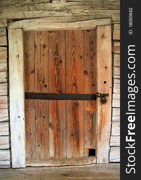 Old door with a large iron lock