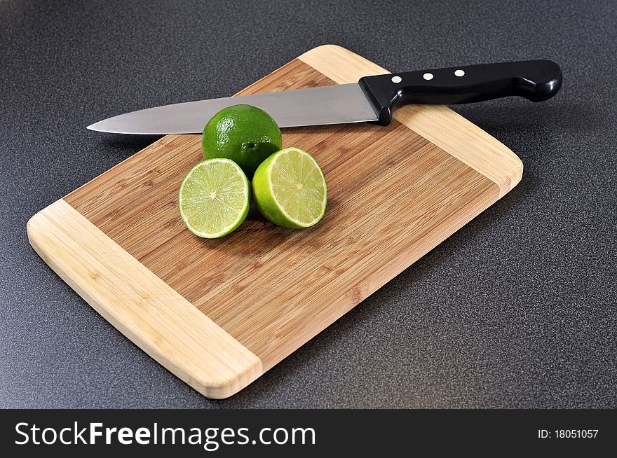 Sliced Lime On A Wooden Plate