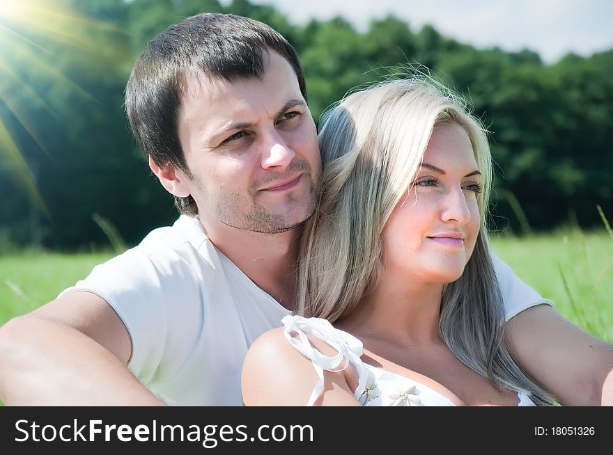 Young love couple on the meadow