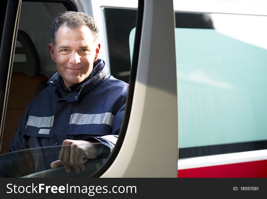 Portrait Of A Male paramedic driving ambulance