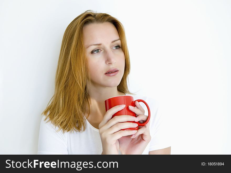 Woman drinking coffee and thinking