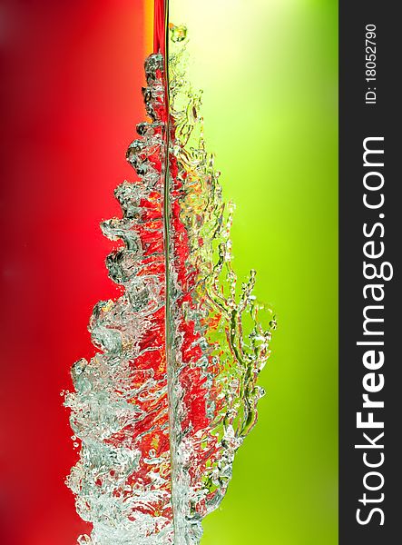 Amazing water splash on fresh red and green background. Amazing water splash on fresh red and green background