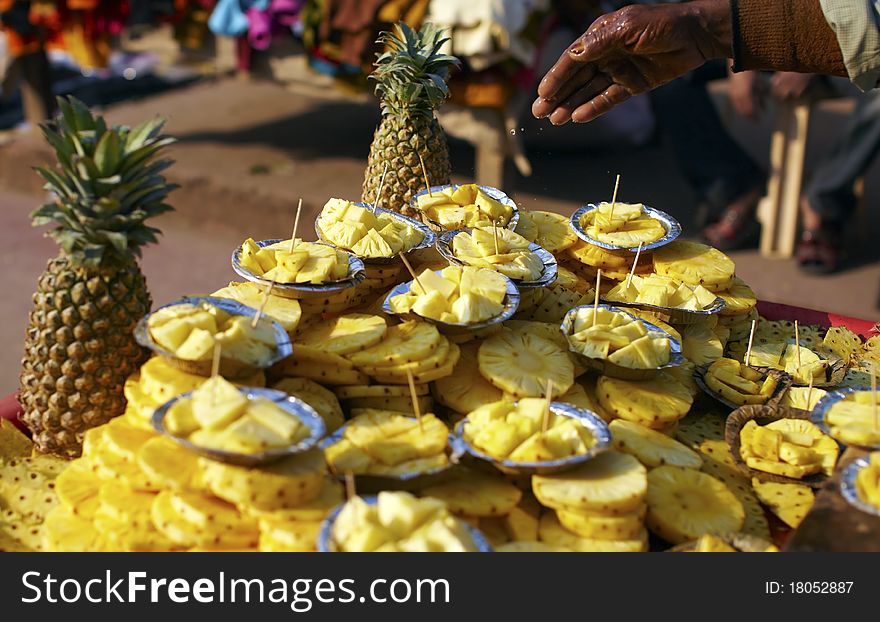 Cut pineapple fruit on the food stall