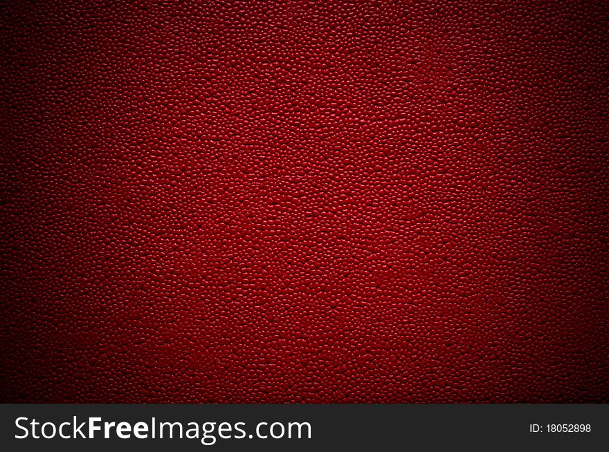 Unusual red leather texture close up with vignette effect. Unusual red leather texture close up with vignette effect