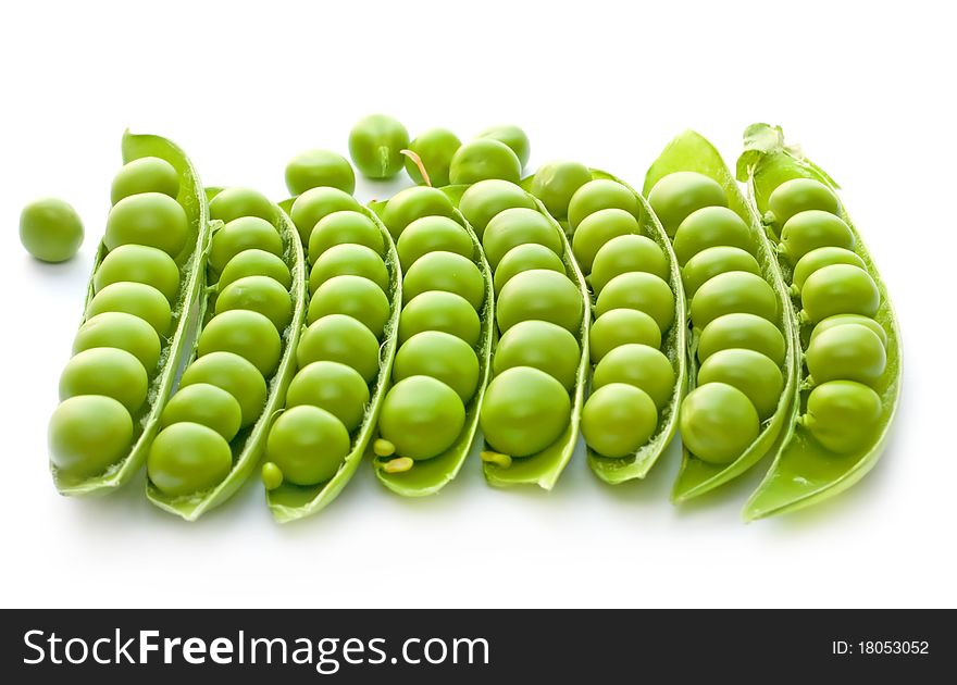 Many of ripe green peas on a white background. Many of ripe green peas on a white background