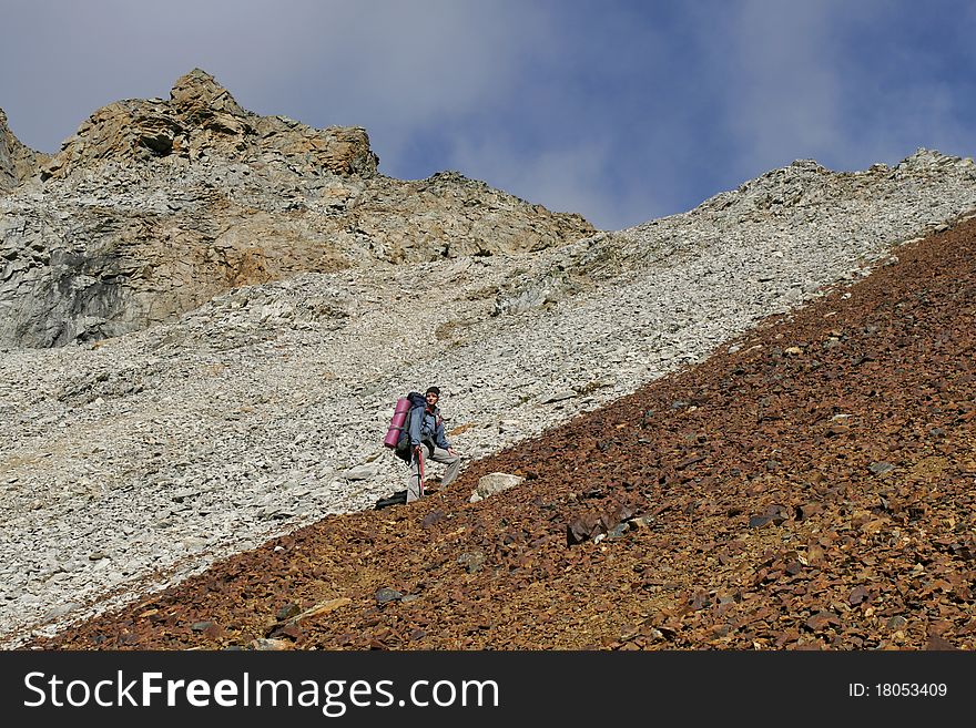 The climber on pass in the Transbaikalia mountains. Russia