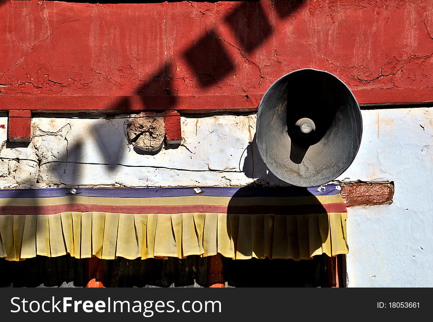 Detail of the Jokang Vihara monastery from Leh, Ladakh, India. Praying flags and a megaphone are visible. Detail of the Jokang Vihara monastery from Leh, Ladakh, India. Praying flags and a megaphone are visible.