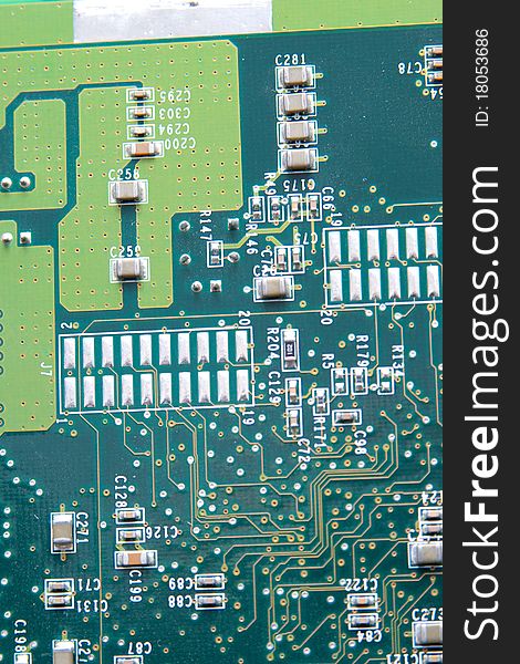 Close up of computer circuit board in green