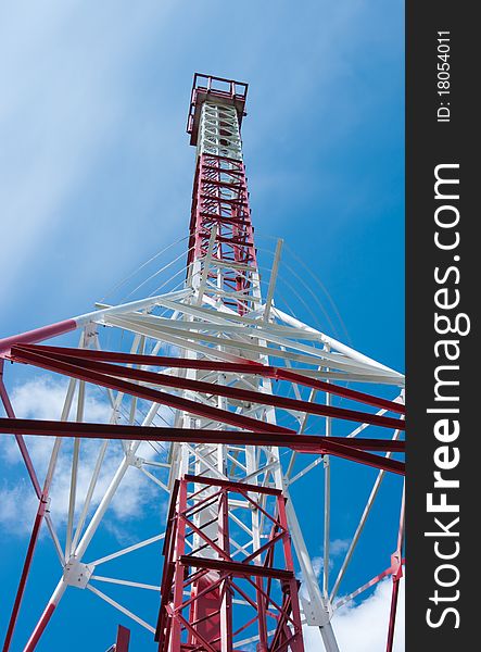 The image of the Mast of communication against the blue sky. The image of the Mast of communication against the blue sky