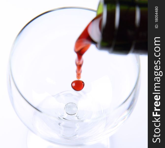 Red wine being poured into a wine glass