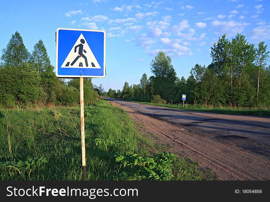 Road sign near asphalt road