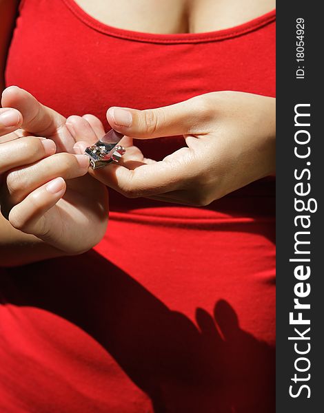 Woman doing fingernails clipping. closeup on hands. Woman doing fingernails clipping. closeup on hands