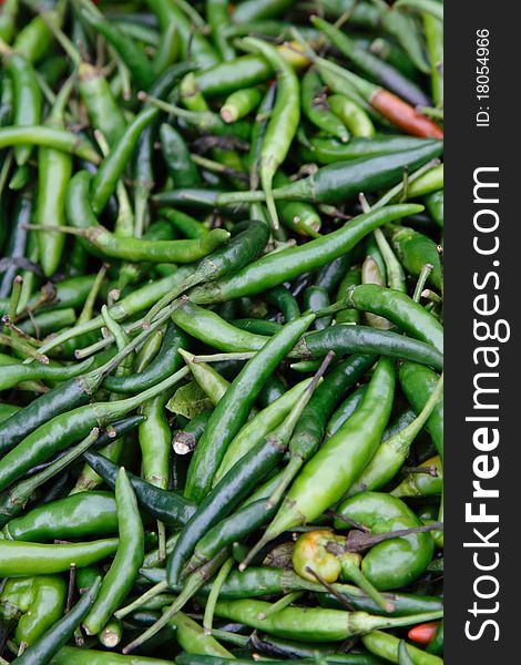 Close-up of small green chillies or cili api/padi (Malay)