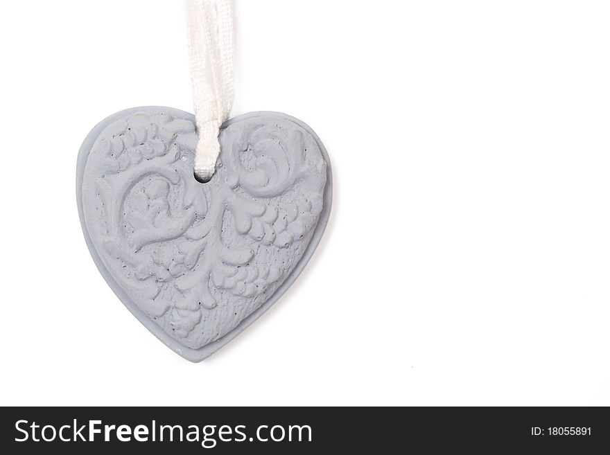 Grey stone heart with patterns on white background. Grey stone heart with patterns on white background